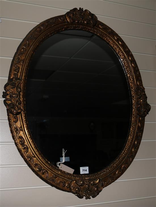 A Victorian oval giltwood and gesso wall mirror, W.2ft 6in. H.3ft 1in.